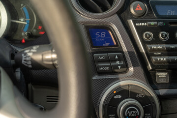 Fototapeta na wymiar use air conditioner in car, climate control dashboard, switching temperature in vehicle