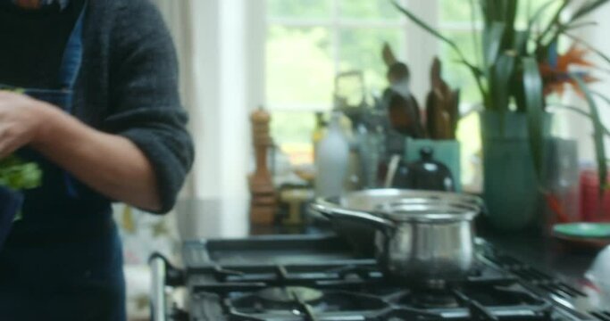 CU Women preparing tart in kitchen / Dorset, UK