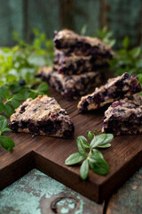 Blueberry scones on oak cutboard with berry leaves