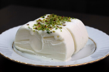 Milk ice cream. Handmade ice cream with pistachio nuts. Maras ice cream. (Maras Dondurmasi)
