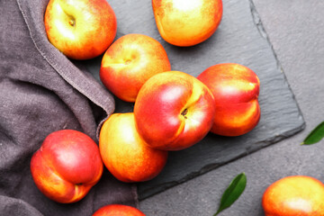 Sweet ripe nectarines on table