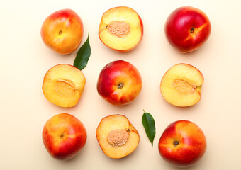 Sweet ripe nectarines on color background