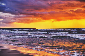Fototapeta na wymiar Sunset view over the sea. Beautiful sunset over the sea. View of the beach, sea and sunset.