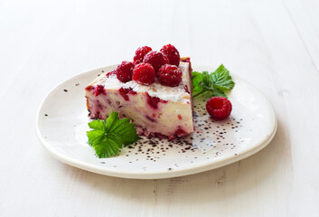 Piece of homemade ricotta and raspberries casserole closeup