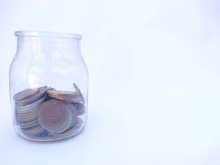 Banknotes and coins on white background