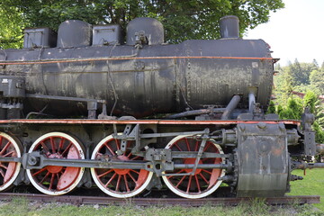 Fototapeta na wymiar Steels wheels of a steam locomotive on display
