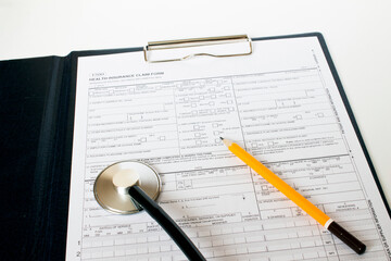 Prescription form lying on table with stethoscope and pencil. Medicine or pharmacy concept.