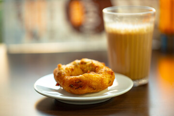 Milk tea with South Indian Vadai or Chai with vada.