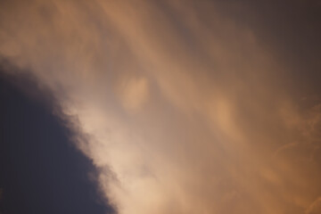 Fototapeta premium Evening clouds against the blue sky