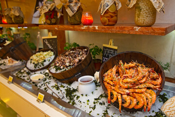 Prawn and shrimps on ice, Seafood buffet line in restaurant