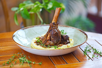 Braised lamb shank on the mashed potato in the restaurant