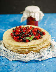 Pancakes with berries. Breakfast. Sweet homemade stack of pancakes