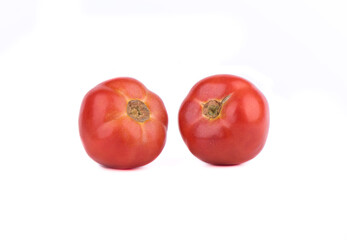 Two ripe red tomatoes are isolated on a white background.