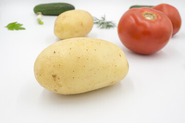 Fresh vegetables on a white background, flat lay.