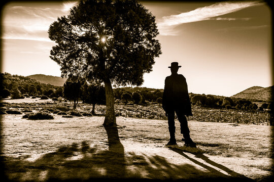 the silhouette of a cowboy at the Sad Hill Cemetery in Contreras at sunrise (Santo Domingo de Silos), province of Burgos, Castile and Leon, Spain