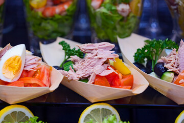 Tuna, boiled egg and vegetable salad in a buffet