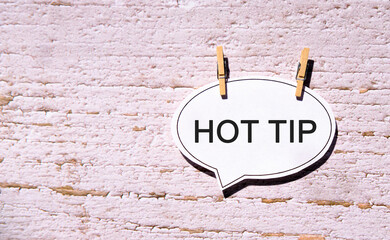 Hot tip on a white sheet with wooden pins