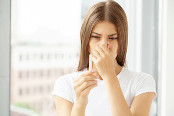 Stop smoking, woman holding a broken cigarette in her hand