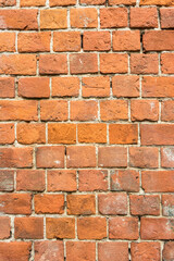 brick red wall. background of a old brick house.
