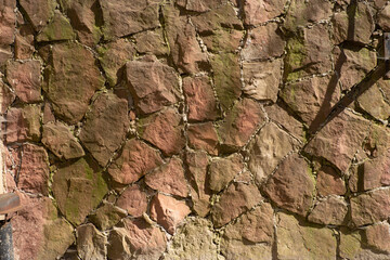 The texture of the old wall from the stones as background.