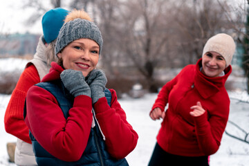 Fototapeta premium Senior Women Friends Dancing And Smiling After Outdoors Training In Park . Active Lifestyle And Friendship at Middle Age. Active And Vibrant Mature Memebers Of Society
