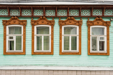 old window in the old town of kolomna russia. wooden house with beautiful carved platbands