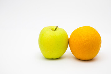 Yellow apple and orange isolated on white background