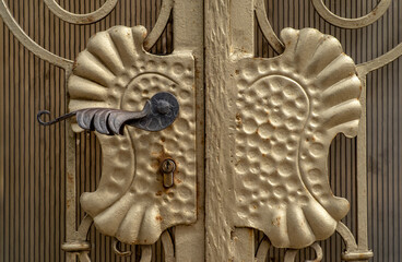 old and modern decorative forged metal elements of fences, gates, window gratings