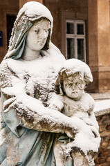 Ukraine. Winter view of St. Mary's sculpture with baby, Jesus Christ, in her hands