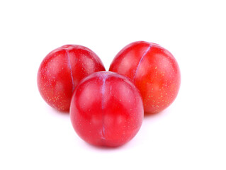 Three Red plum isolated on a white background. Ripe organic plums. Healthy food