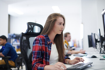 casual business woman working on desktop computer