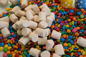 Different sweets decorating a beautiful party table.