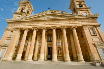 The front facade and entrance to the Mosta Rotunda or Basilica of the Assumption of Our Lady in Mosta, Malta.