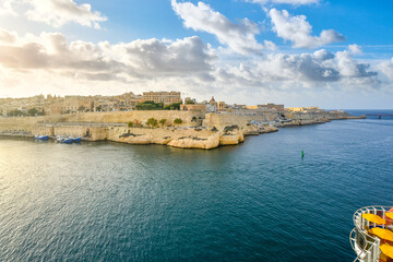 Naklejka premium View of the skyline of the ancient walled city of Valletta Malta from a cruise ship in the Grand Harbor of the Mediterranean Island.