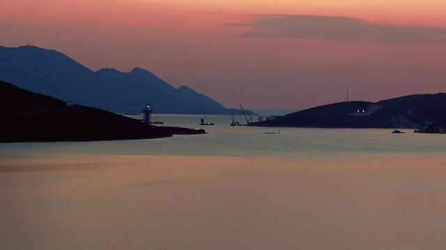 A view over sea bay at dusk at the end of hot summer day in Neum, Bosnia and Herzegovina.