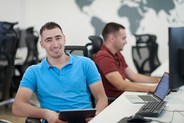 two male software developers working on computer