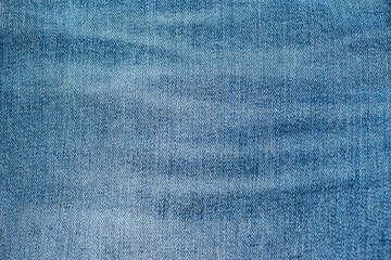 Naklejka premium Background from denim. Light blue jeans textile. Flat lay.
