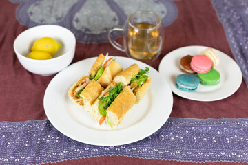 Bahn mi, colorful macarons, and tea