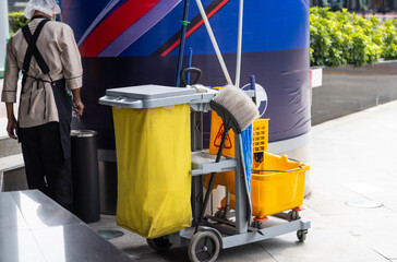 man worker  working with janitorial, cleaning equipment and tools for floor cleaning interior building.