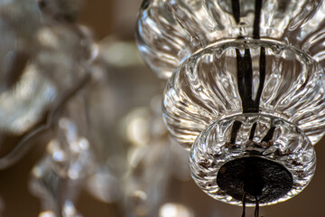 a fragment of an antique glass chandelier. Large crystal chandelier close-up.