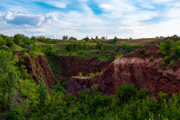 Fototapeta na wymiar Ukraine, Krivoy Rog, the 16 of July 2020. Earth sinkhole in the abandoned park outskirts of the city. So called 