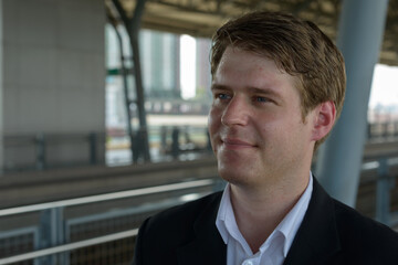 Fototapeta premium Portrait of young handsome businessman at the airport