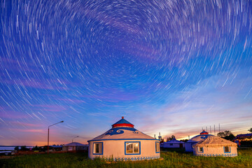 The mongolia yurts under the starry sky in the night.