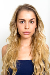 Naklejka premium Portrait of young beautiful woman with blonde hair