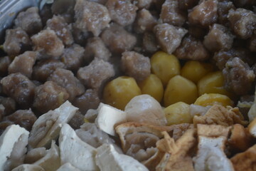 Indonesian food called Siomay in a pot consisting of potatoes, tofu and vegetables all steamed