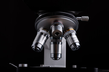 close-up microscope isolated on black background