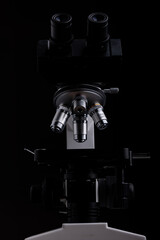 close-up microscope isolated on black background