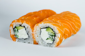 Sushi rolls philadelphia classic with fresh salmon and cream cheese. Japanese traditional food