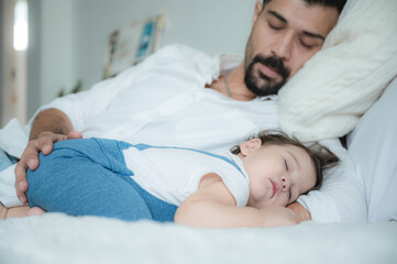 Obraz na płótnie Canvas baby are sleeping on white bed at home