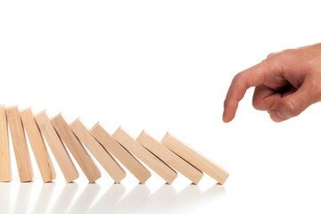 Hand Pushing Domino Pieces